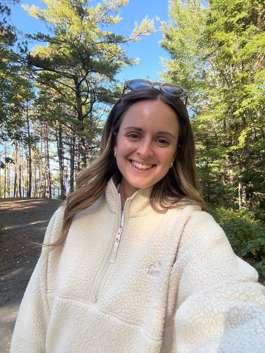 Megan Linzel smiling in a forest